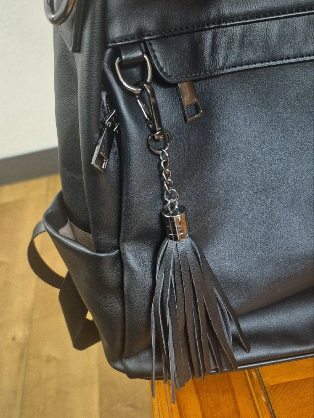 Classic Black Faux Leather Backpack with Tassel Accent